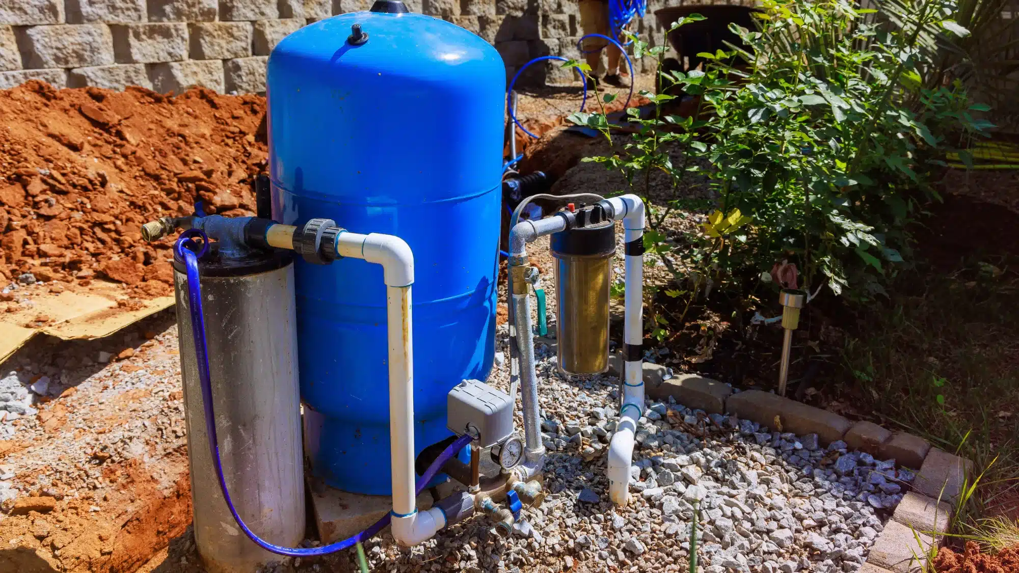 the-leading-water-pump-service-companies-serving-residential-and-commercial-properties-in-tolland Professional water pump service technician inspecting and repairing a commercial and residential water pump system in Tolland Connecticut