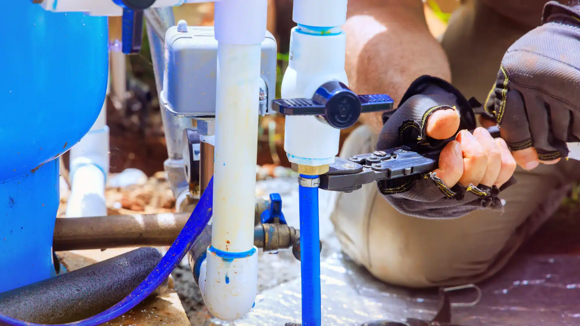 the-warning-signs-your-water-pump-needs-repair-in-stafford-ct-before-major-damage-occurs Technician inspecting a residential well water pump system for signs of wear and potential repair issues in Stafford Connecticut